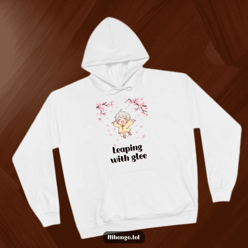 Funny joyful character hoodie showing a character leaping with joy amidst cherry blossoms, offering warmth and comical celebration.