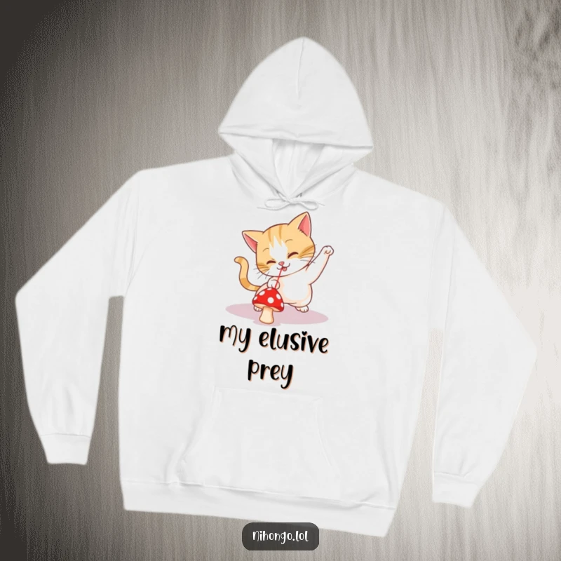 Funny hoodie depicting a playful cat eagerly chasing a small red mushroom, thinking it is a laser pointer dot.